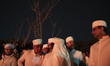 Iranian Zoroastrian priests stand together in an open area during the ancient mid-winter S...