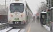 Steam rises from a heated pathway as a GO train leaves the Innovation District station in...