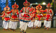 Participants perform during the annual Nawam Buddhist procession in Colombo, Sri Lanka, on...