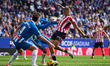 Maroan Sannadi of Athletic Bilbao takes a shot inside the box under pressure from Marash K...