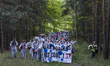 Anti-coal activists march to a loading station by the Welzow Sued open-pit coal mine on Ma...