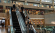 People ride down an escalator in a shopping mall in the central district in Hong Kong, on...