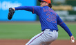New York Mets relief pitcher Trey Mcloughlin #32 throws during the fifth inning of a sprin...