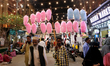 A cotton candy vendor walks along a street in Kolkata, India, on March 1, 2025. 