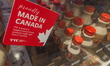 CALGARY, CANADA - MARCH 4, 2025:'Made in Canada' stickers displayed next to price tags of...