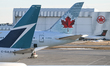 CALGARY, CANADA - MARCH 4, 2025:Air Canada and Westjet aircraft parked at Calgary Interna...