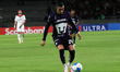 Rogelio Funes Mori #29 of Pumas de la UNAM dribbles the ball during the first leg match of...