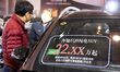 People visit the Benz booth at the 2025 Spring International Auto Show in Qingdao, China,...
