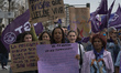 A group of women with feminist banners participates in the demonstration for International...