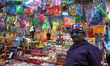 Vendors sell color powders and pichkaris for the upcoming Holi festival in Kolkata, India,...