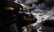 Palestinian workers work in a workshop to produce gasoline and diesel from plastic waste t...