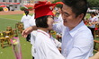 A student hugs her father at a coming-of-age ceremony in the No. 1 Middle School of Botou...