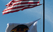 The United States Flag (''Old Glory'') flies above the Crew 10 Flag at Kennedy Space Cente...