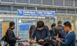 Asian travelers are at the customs clearance and tax refund counter at Munich Airport in U...