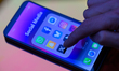 Social media icon applications from X and Snapchat, alongside others, are seen on a mobile...