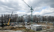 Tower cranes are seen during construction work on the premises of the underground school a...