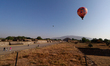 Balloons fly over the Pyramid of the Sun during the welcoming of the spring equinox at the...