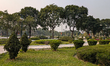 A group of elderly men sit in a quiet, green city park in Thanh Hoa, Vietnam, on March 24,...