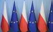 Poland's national flags and European Union flags are pictured before a meeting to discuss...