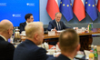 Polish Prime Minister Donald Tusk (R) and Minister for the European Union Adam Szlapka (L)...