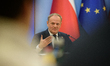 Polish Prime Minister Donald Tusk gestures as he speaks during a meeting with the entrepre...