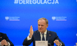 Polish Prime Minister Donald Tusk gestures as he speaks during a meeting with the entrepre...