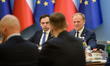 Polish Prime Minister Donald Tusk (R) and Minister for the European Union Adam Szlapka (L)...