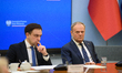Polish Prime Minister Donald Tusk (R) and Minister for the European Union Adam Szlapka (L)...