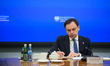 Polish Minister for the European Union, Adam Szlapka, takes notes during a meeting between...
