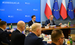 Polish Prime Minister Donald Tusk (R) and Minister for the European Union Adam Szlapka (L)...