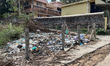 Garbage is dumped in an empty lot beside a home in Neyyattinkara, Kerala, India, on April...