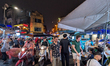 People walk and gather at bars and restaurants in the Amusement District of the Old Quarte...