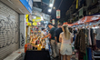 Tourists and locals explore street stalls at the Old Quarter Night Market in Hanoi, Vietna...