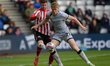 Sunderland's Chris Mepham holds back Millwall FC's Josh Coburn during the Sky Bet Champion...