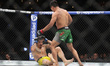David Martinez of Mexico (right) drops Saimon Oliveira of Brazil (left) in a bantamweight...