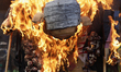 Members of various social organizations and collectives in support of Palestine burn the s...