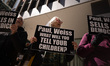 Protesters demonstrate outside the building that houses, among other companies, the New Yo...