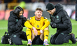 Jorgen Strand Larsen of Wolverhampton Wanderers receives treatment following a minor knock...