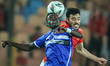 Akram Tawfik of Al Ahly battles for possession with Walieldin Khdir Safour Daiyeen of Al H...