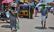 Vehicle and pedestrian traffic occurs at the Chalai market in Thiruvananthapuram, Kerala,...