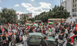 Pro-Palestinian demonstrators wave Palestinian flags during a national march organized by...