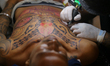 Tattoo artists and enthusiasts get tattooed during the ''Nepal Tattoo Convention'' organiz...