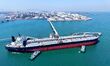 A cargo ship loaded with imported crude oil docks at the dock at Qingdao Port in Shandong...