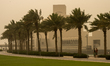 People walk at the Museum of Islamic Art during a sandstorm in Doha, Qatar, on April 15, 2...
