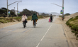 Residents and visitors visit Sunset Dunes coastal park in San Francisco, Calif., on April...