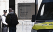 Police stand in front of the Department for Work and Pensions in Westminster, London, on A...