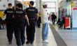 German police officers patrol inside the central train station in Regensburg, Upper Palati...