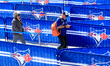 Baseball fans enter queue lines outside the Rogers Centre before a Major League Baseball g...
