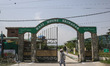 A Kashmiri Muslim man walks outside the Hajj House in Srinagar, Jammu and Kashmir, on Apri...