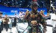 A 'Black Myth: Wukong' character poses at the BYD booth at the National Exhibition Center...